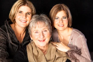 Three women with personalised occasion makeup posing together